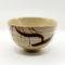 Vintage handmade beige Japanese matcha bowl with brush stroke design and artist’s impressed mark. available at j-okini.com in Malta