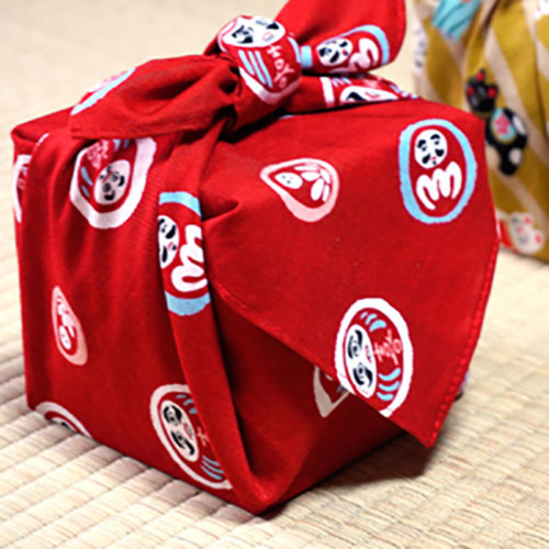 Red Furoshiki cloth with round Daruma doll pattern, 48cm square, made in Japan. Available at j-okini.com in Malta