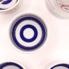 The cups feature the distinctive Janome (snake’s eye) blue double circle design, traditionally used in sake tasting to assess the color, clarity, and brilliance of the sake. The white and indigo contrast allows for precise appreciation of fine sake — a nod to Japan’s long-standing sake culture.