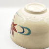 Vintage handmade Kyo-yaki Matcha bowl with maple leaf and sakura design on cream glaze, accented with blue curved lines.