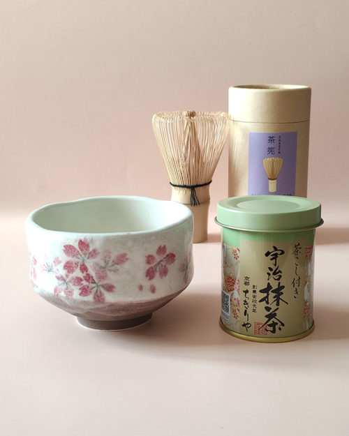 A simple set including Uji Matcha in a tin, a Matcha bowl with a sakura design made in Japan and Matcha whisk