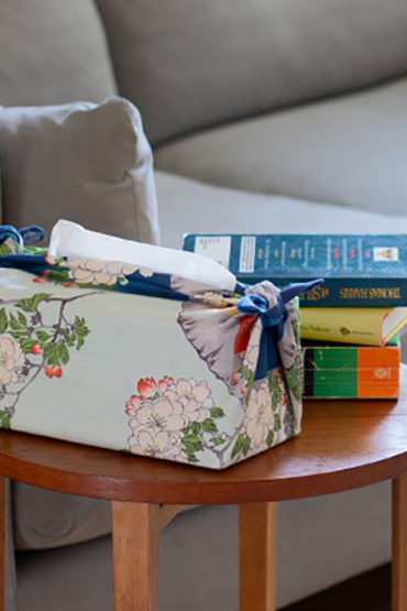 Ukiyo-e furoshiki wrapping used for a tissue box, Utagawa Hiroshige’s “Sumidagawa Suijin no Mori Massaki.” 100% cotton. Available at j-okini.com in Malta
