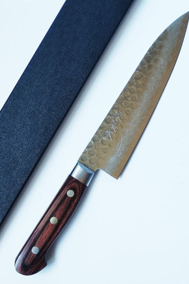 Shop the 180mm Japanese Gyutou knife crafted in VG10 Damascus steel with Tsuchime hammered finish. A versatile, razor-sharp all-purpose chef’s knife designed for home cooks and professionals seeking precision and beauty. j-okini.com in Malta