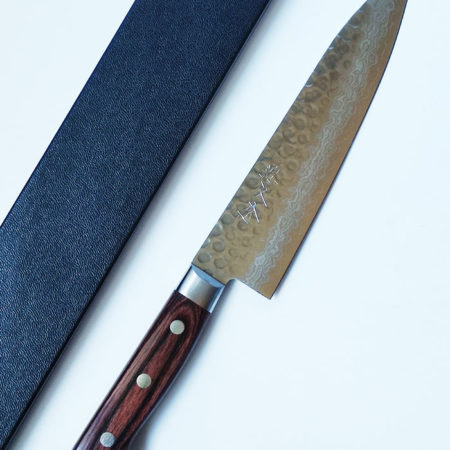 Shop the 180mm Japanese Gyutou knife crafted in VG10 Damascus steel with Tsuchime hammered finish. A versatile, razor-sharp all-purpose chef’s knife designed for home cooks and professionals seeking precision and beauty. j-okini.com in Malta