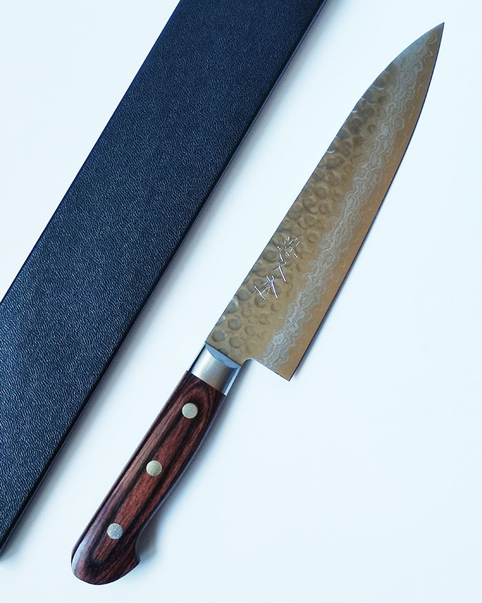 Japanese Kitchen Knife Gyutou 180mm | Hammered VG10 Damascus Shop the 180mm Japanese Gyutou knife crafted in VG10 Damascus steel with Tsuchime hammered finish. A versatile, razor-sharp all-purpose chef’s knife designed for home cooks and professionals seeking precision and beauty. j-okini.com in Malta