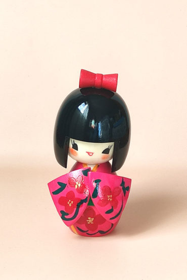 Creative Japanese Kokeshi doll Hana Mizuki by Yamagishi Masayoshi with pink kimono and dogwood flower design. Available at j-okini.com in Malta
