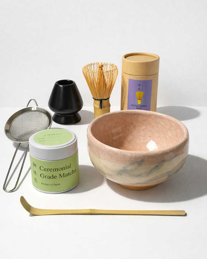 Luxury Japanese ceremonial matcha tea set with handmade Kiyomizu ware bowl, bamboo whisk, scoop, whisk holder, tea sifter, and Miyabi ceremonial grade matcha.