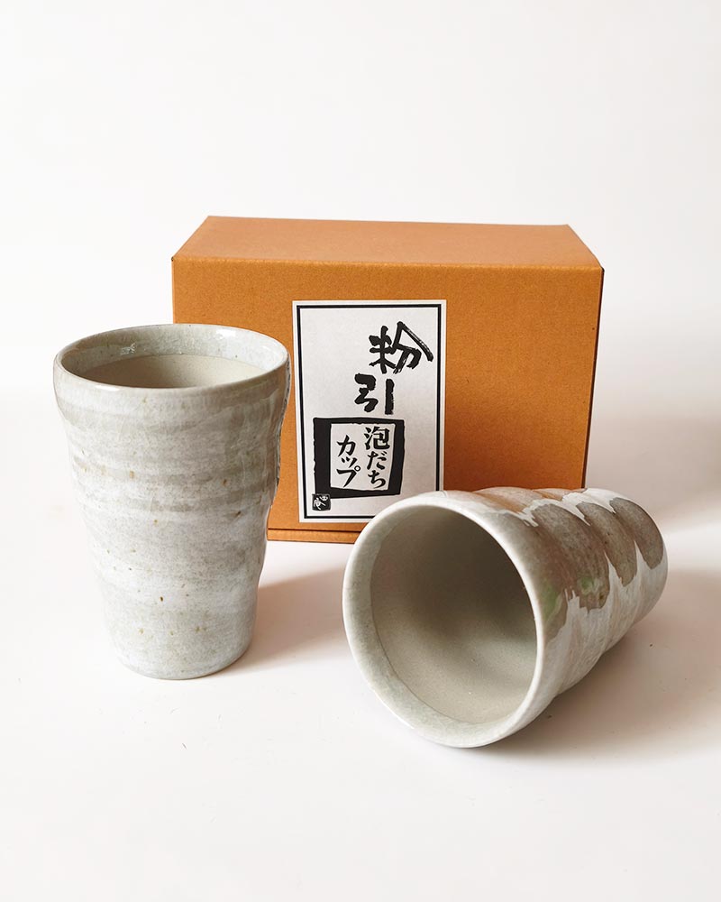 Pair of Japanese Mino Ware Kohiki ceramic beer cups designed to create creamy foam, 180ml each
