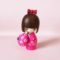 Haru Urara Japanese wooden kokeshi doll by Kojo wearing a pink floral kimono and holding a matching Japanese umbrella.