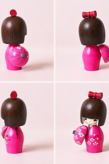 Haru Urara Japanese wooden kokeshi doll by Kojo wearing a pink floral kimono and holding a matching Japanese umbrella.