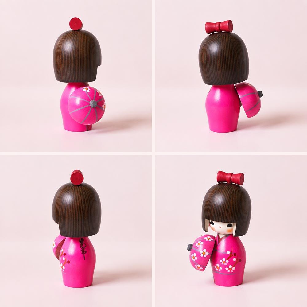 haru-urara2 Haru Urara Japanese wooden kokeshi doll by Kojo wearing a pink floral kimono and holding a matching Japanese umbrella.