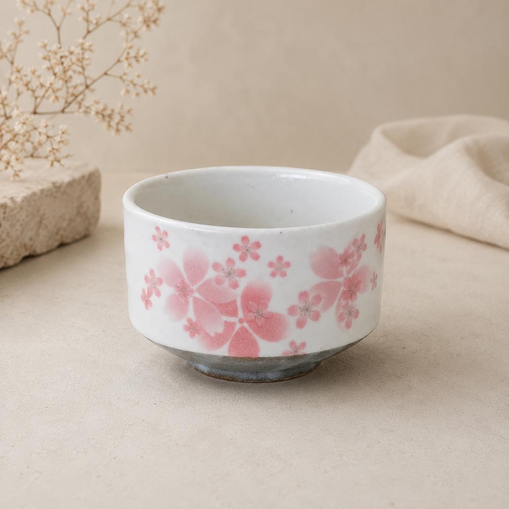 Japanese Sakura layered matcha bowl made in Japan with layered pink cherry blossom design, white Mino ware chawan and grey base