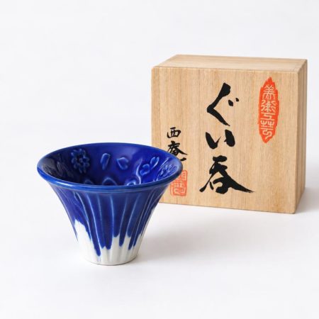 Blue Mount Fuji porcelain sake cup with cherry blossom details inside, presented with a paulownia wooden gift box.. Available at j-okini Malta